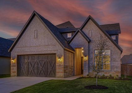 Angled exterior of the Welch with professional front yard landscaping.