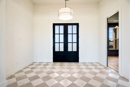 Entryway featuring french doors