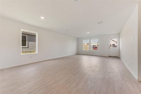 Spare room with light hardwood / wood-style floors