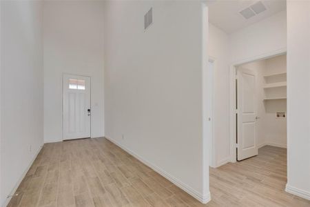 Entrance foyer featuring light hardwood / wood-style flooring