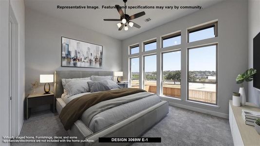 Carpeted bedroom with ceiling fan