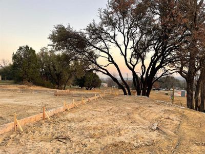 Yard at dusk featuring a rural view