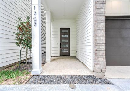 Front entrance large enough to have some patio furniture.