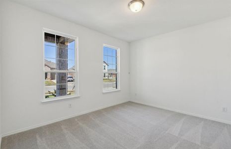 Spacious owner's suite bedroom*real home pictured