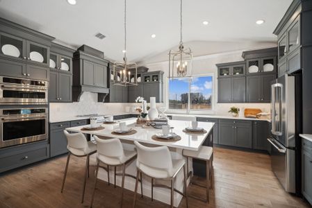 Kitchen with pendant lighting and vaulted ceiling