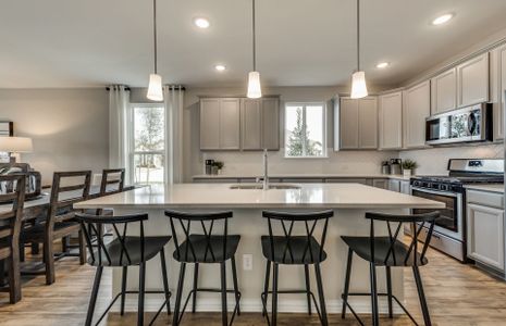 Gorgeous kitchen with recessed and pendant lightin