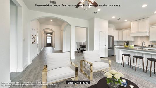 Living room with ceiling fan, sink, and light hardwood / wood-style floors