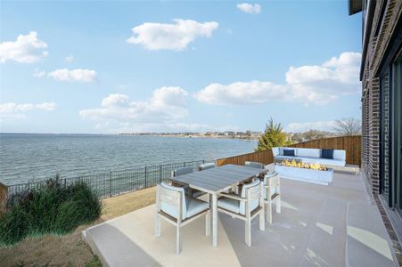 Virtually staged view of back patio overlooking Lake Ray Hubbard. You can see the nearby Heath Golf & Yacht, Chandler's Landing, and the dam from this location.