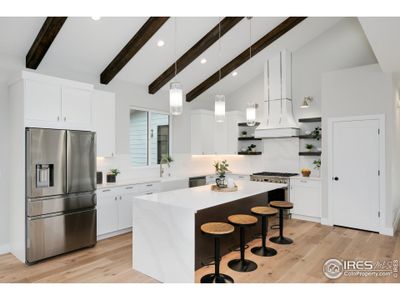 Vaulted Ceilings with Southern oriented picture windows creates a home drenched in natural light.