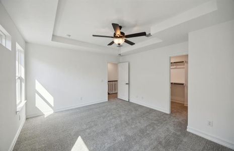 Elegant owner's suite with Tray ceiling  *real home pictured