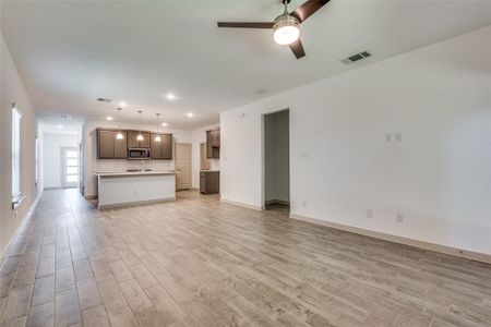 The living room is open to the kitchen and dining room for a grander feel.