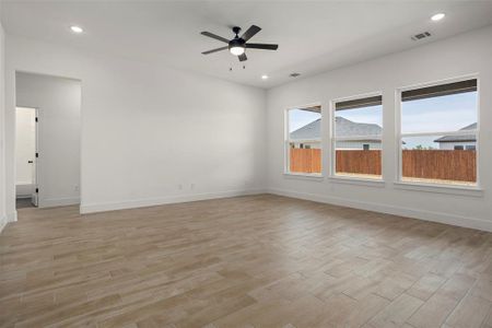 Spare room featuring light hardwood / wood-style flooring and ceiling fan