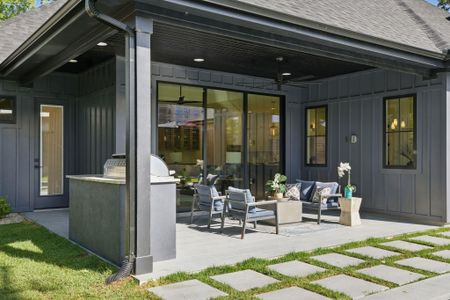 View of patio featuring outdoor lounge area and a ceiling fan View of patio featuring outdoor lounge area and a ceiling fan