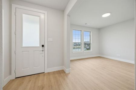 Foyer with light hardwood / wood-style flooring