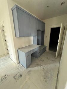 Kitchen featuring gray cabinetry