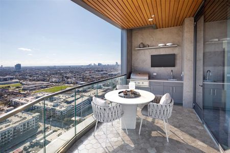 Savor the captivating downtown view from the balcony with a summer kitchen. Enjoy alfresco dining and entertaining with an outdoor kitchen while soaking in the mesmerizing cityscape that surrounds you. (Model Photo 2304)