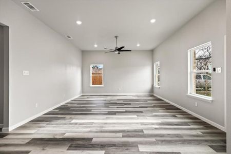 Family room featuring ceiling fan and light wood-type flooring