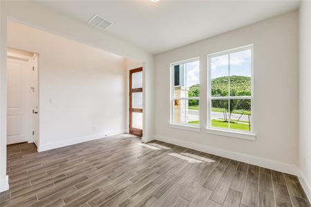 Upon entry, a handsome office overlooks the front yard and happenings on Red Bottle Brush.