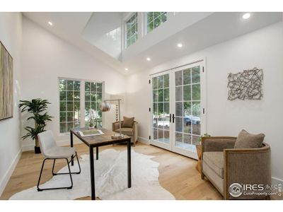 Large front office featuring abundant windows and french doors leading to a patio