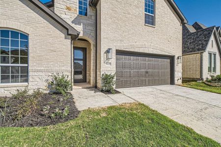 Doorway to property featuring a garage