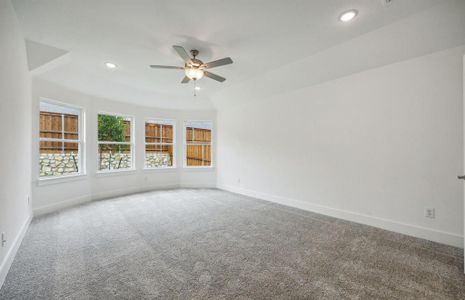 Elegant owner's suite with bay window *real home pictured