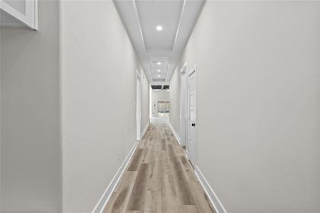 Hallway featuring light hardwood / wood-style flooring