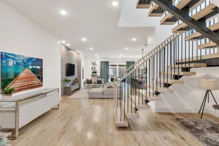 Staircase featuring wood-type flooring