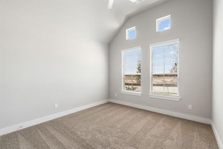 Generously sized secondary bedrooms, complete with spacious closets and soft, inviting carpeting. Enjoy abundant natural light streaming in through the large windows, complemented by privacy blinds for your personal sanctuary. Sample photo of completed home with similar floor plan. As-built interior colors and selections may vary.