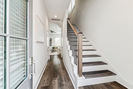 Step inside and be greeted by high ceilings, LED recessed can lighting, soothing paint colors and stylish wood railing with iron spindles on the stairway.