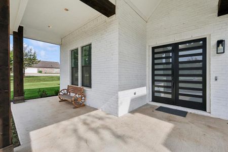 Property entrance featuring french doors