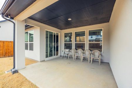 View of patio featuring fence