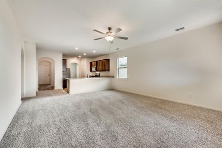 Living room with light carpet and ceiling fan