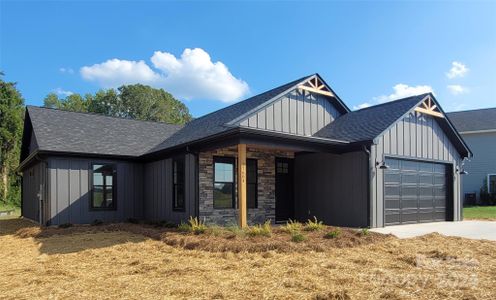 Side of Home w/ Added Stacked Ston Entry Wall, Accent Wood on Front Gable Eaves: ALL Pics are of Previous Builds and are For Visual Purposes Only. We have built this plan with many different added upgrades and add-on finishes for the Exterior and Interior. Final Price TBD based on the added cost of buyers' selected upgrades and finishes.