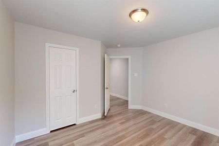 Unfurnished bedroom with light hardwood / wood-style floors