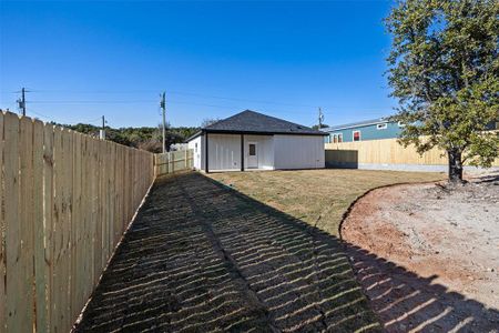 Back yard with privacy fence and sod