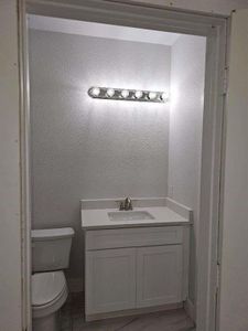 Bathroom featuring toilet and vanity