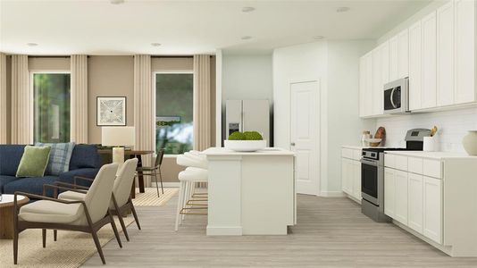 Kitchen with white cabinetry, appliances with stainless steel finishes, a kitchen bar, and a center island with sink