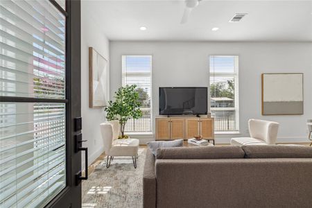 As you enter your home the living room is showcased along with natural light that comes from adjoining walls with oversized windows.