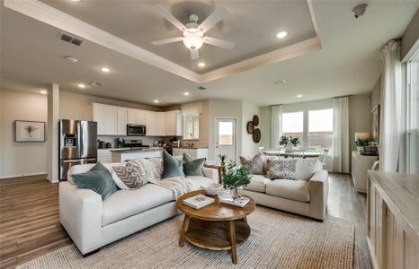 Sun-bathed gathering room with expansive room for entertaining *Real Home pictured, former model.