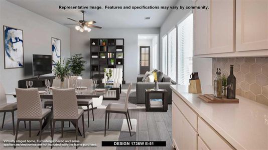 Dining space with ceiling fan and light hardwood / wood-style flooring