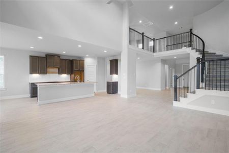 Another beautiful view from the Family Room into the kitchen and staircase leading to the second floor.