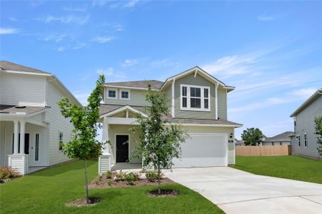 View of front of house with driveway, a garage, and a shingled roof View of front of house with driveway, a garage, and a shingled roof