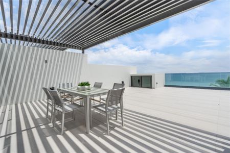 East facing roof-top terrace with ocean views and grill.