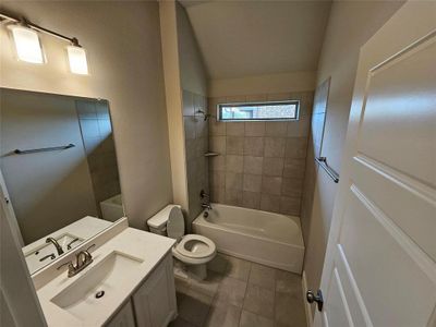 Bath 2 with Quartz vanity, tub/Shower, and 12x24 tile.