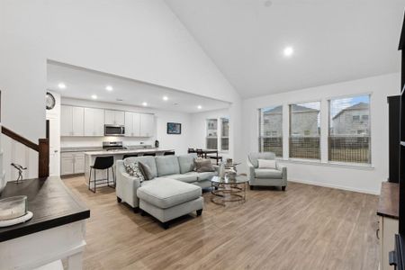 Move freely from the living room into the dining room and kitchen. Also, enjoy the walls of windows that allow the natural light to pour in.