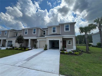 New construction Townhouse house 34222 Polacca Lane, Wesley Chapel, FL 33543 - photo 0