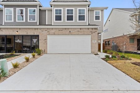 View of property with a garage