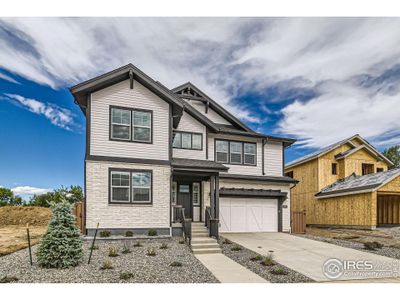 Backs to Coal Creek Golf Course with views of Flatirons and Longs Peak