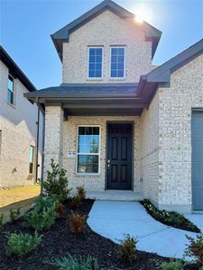 Doorway to property with brick siding