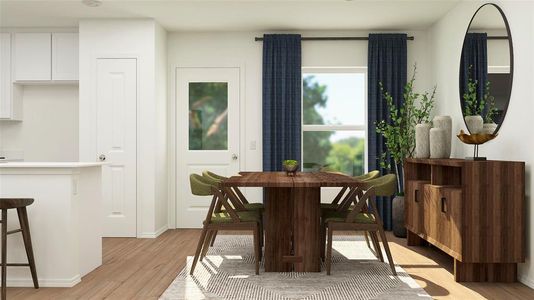 Dining area with light hardwood / wood-style flooring